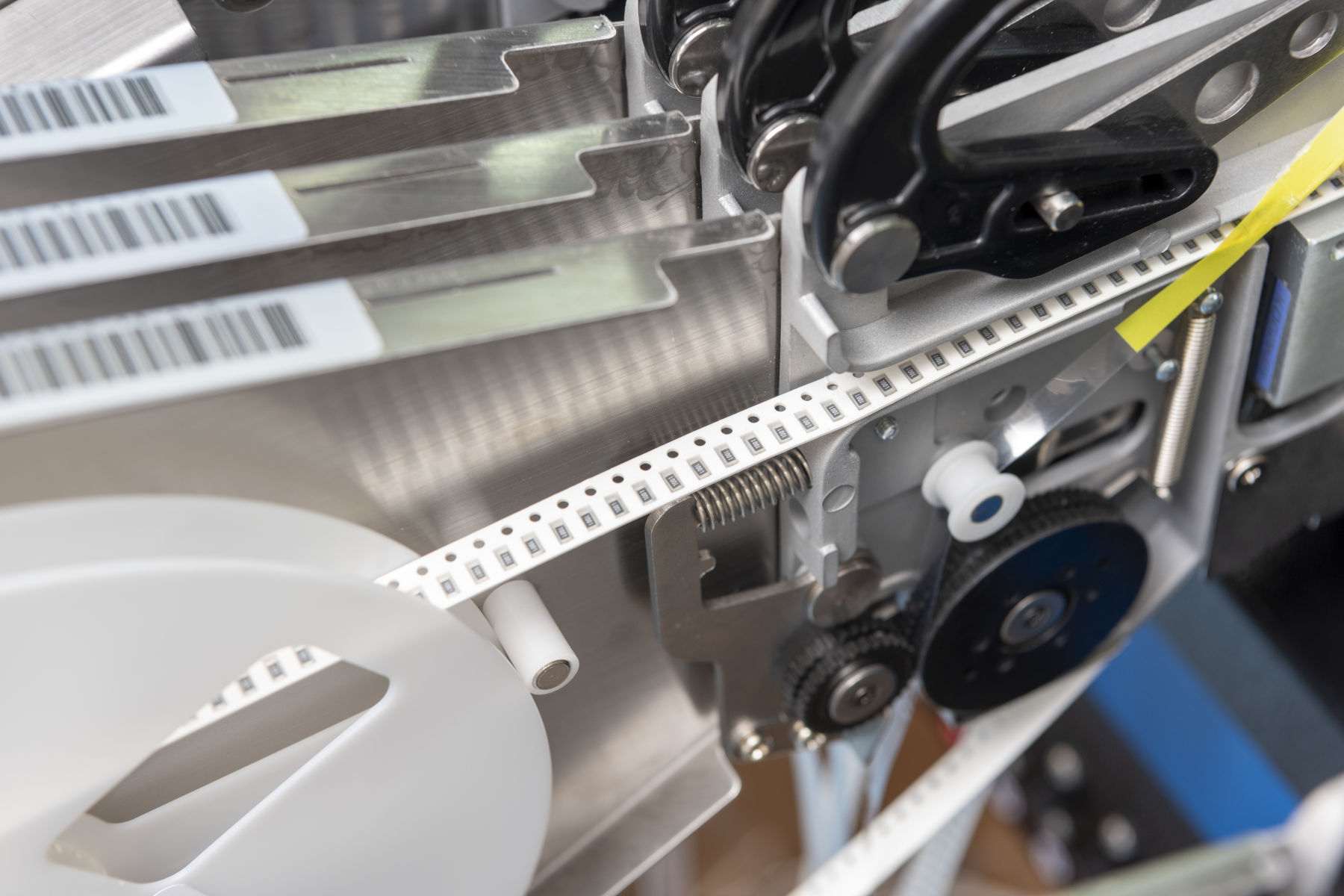 Electronic component feeder reels on an automated pick and place PCB assembly machine