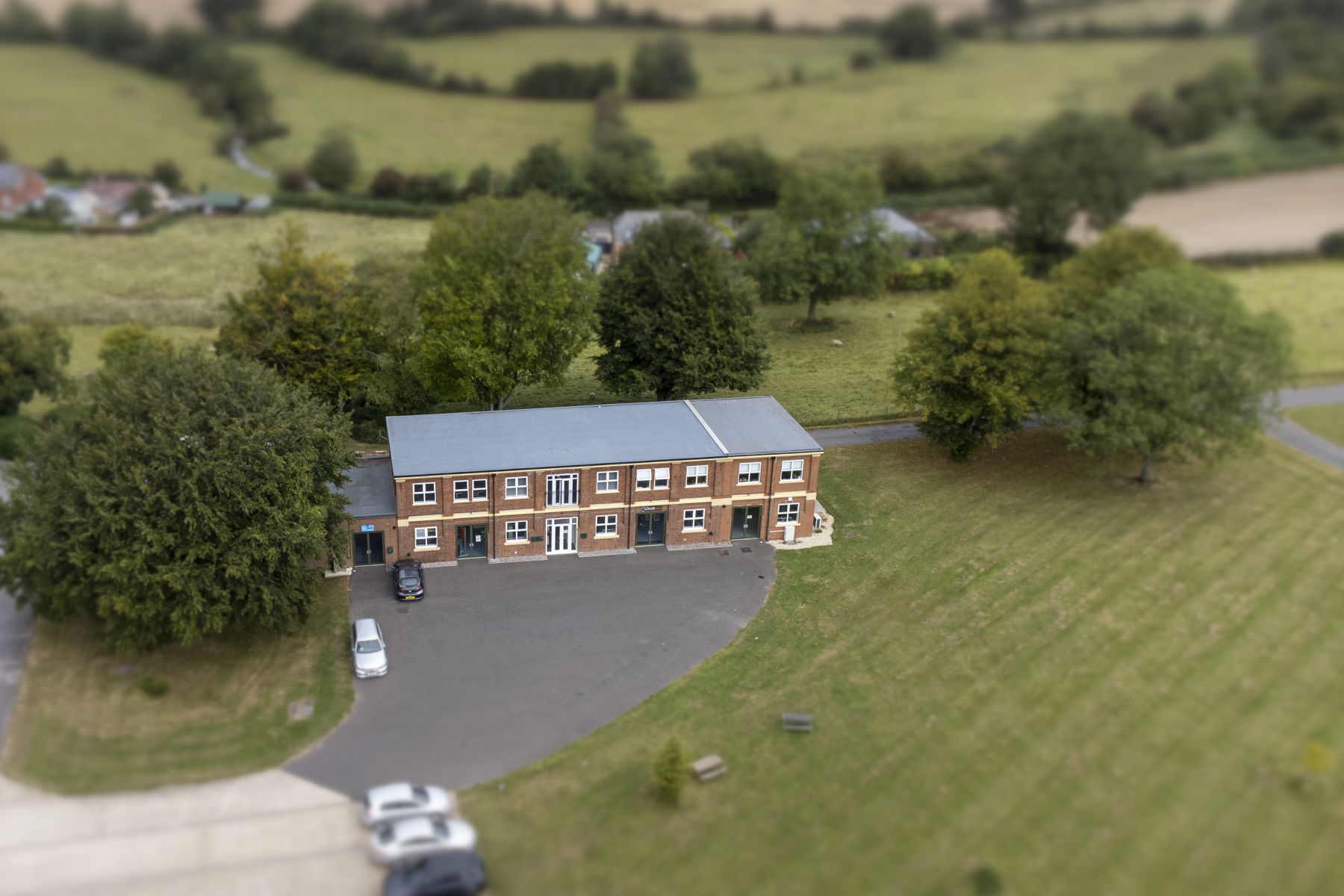 Aerial shot of CircuitWorx office building surrounded by green countryside